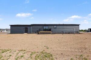 Rear exterior of a new dark gray manufactured home at 11856 Danton Circle in Allendale, MI