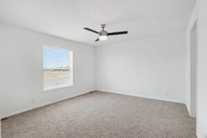 Carpeted bedroom with ceiling fan in a new manufactured home at 11856 Danton Circle in Allendale, MI
