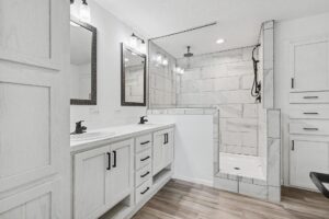 Bathroom with double vanity and tile shower in a new manufactured home at 11856 Danton Circle in Allendale, MI