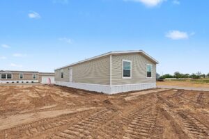 Rear exterior of a new manufactured home on its lot at 4140 Shalimar Dr in Allendale, MI