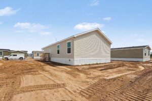 Side exterior of a new manufactured home under a blue sky at 4152 Shalimar Dr in Allendale, MI
