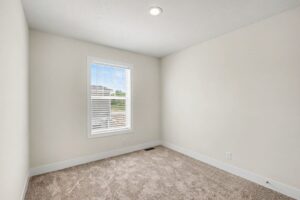 Carpeted bedroom with window in a new manufactured home at 4152 Shalimar Dr in Allendale, MI