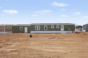 Rear exterior of a new green manufactured home at 4159 Shalimar Dr in Allendale, MI