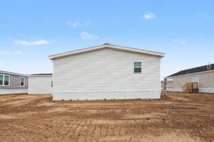 Rear exterior of a new white manufactured home at 4160 Shalimar Dr in Allendale, MI