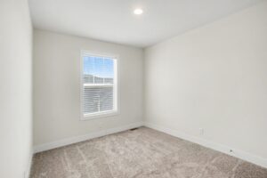 Carpeted bedroom with window in a new manufactured home at 4180 Shalimar Dr in Allendale, MI