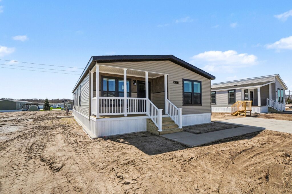 Front exterior of a new manufactured home with covered porch at 4188 Shalimar Dr in Allendale, MI