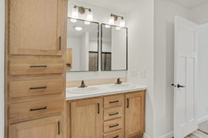 Bathroom with oak double vanity in a new manufactured home at 4188 Shalimar Dr in Allendale, MI
