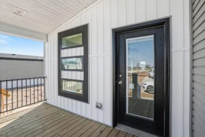 Covered porch and black front door on a new manufactured home at 4198 Shalimar Dr in Allendale, MI