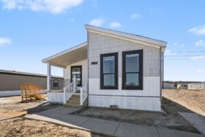 Front exterior of a new gray manufactured home with shake accents at 4198 Shalimar Dr in Allendale, MI