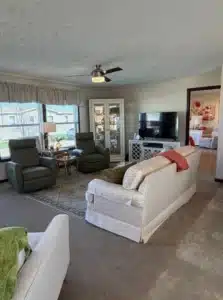Furnished living room with sectional in a pre-owned manufactured home at 4393 Twilight Way in Allendale, MI
