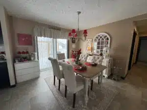 Dining room with table and chandelier in a pre-owned manufactured home at 4393 Twilight Way in Allendale, MI