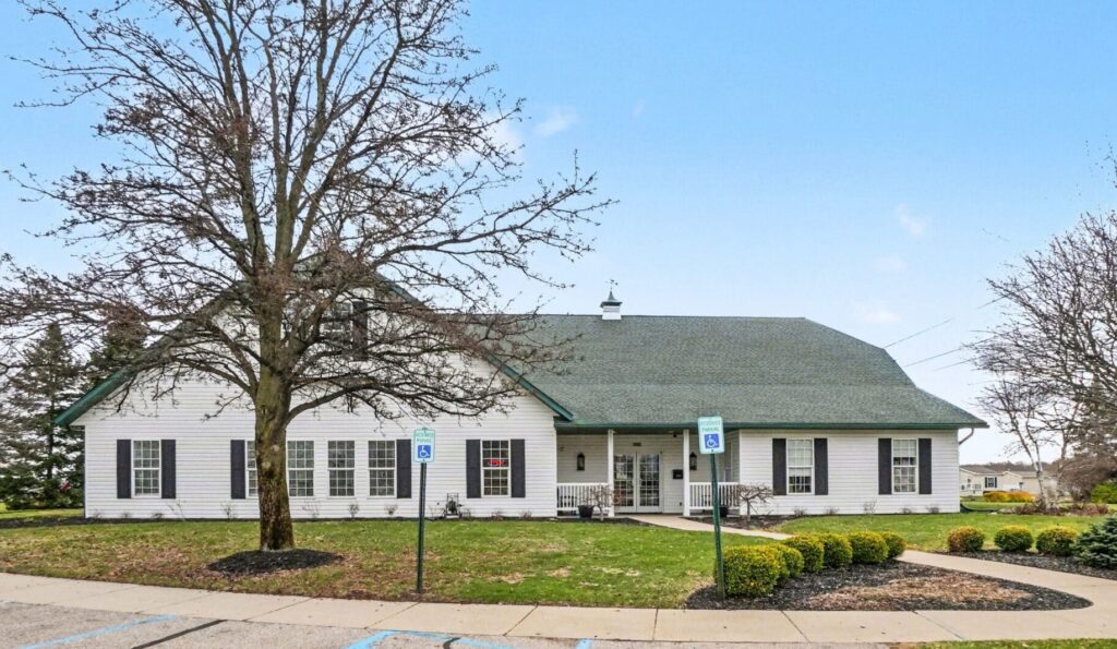 Front of the Boulder Ridge clubhouse under a large oak tree in Allendale, MI