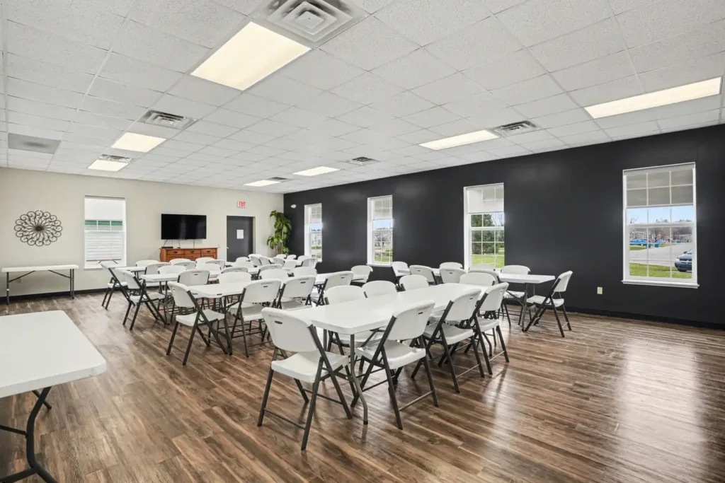 Clubhouse event room with tables set for residents at the manufactured home community in Allendale, MI