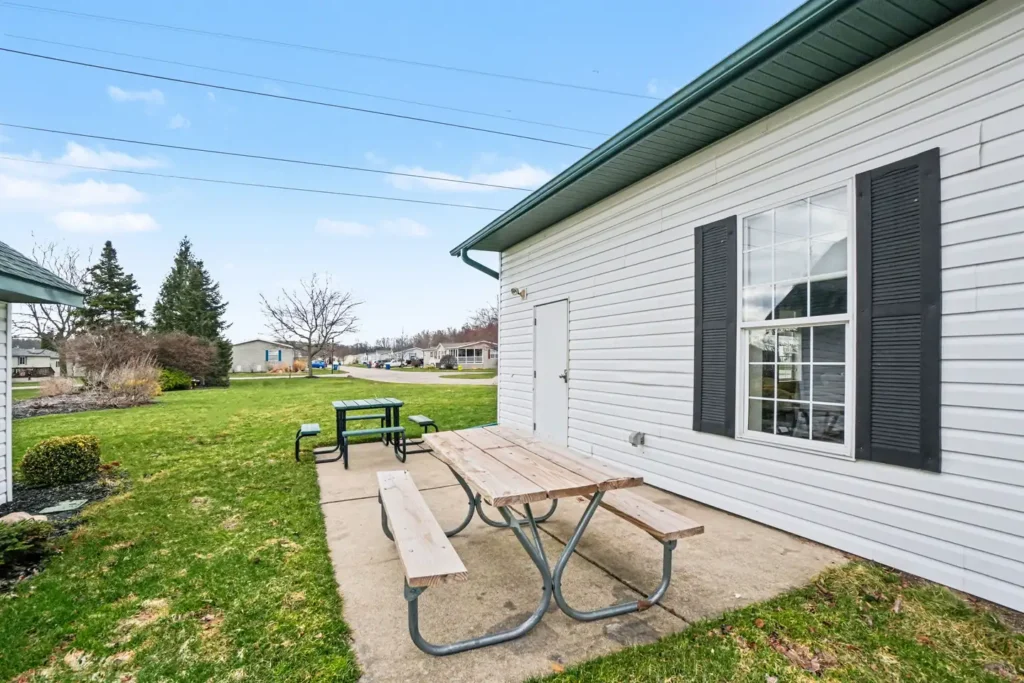 Picnic table behind the clubhouse at the manufactured home community in Allendale, MI