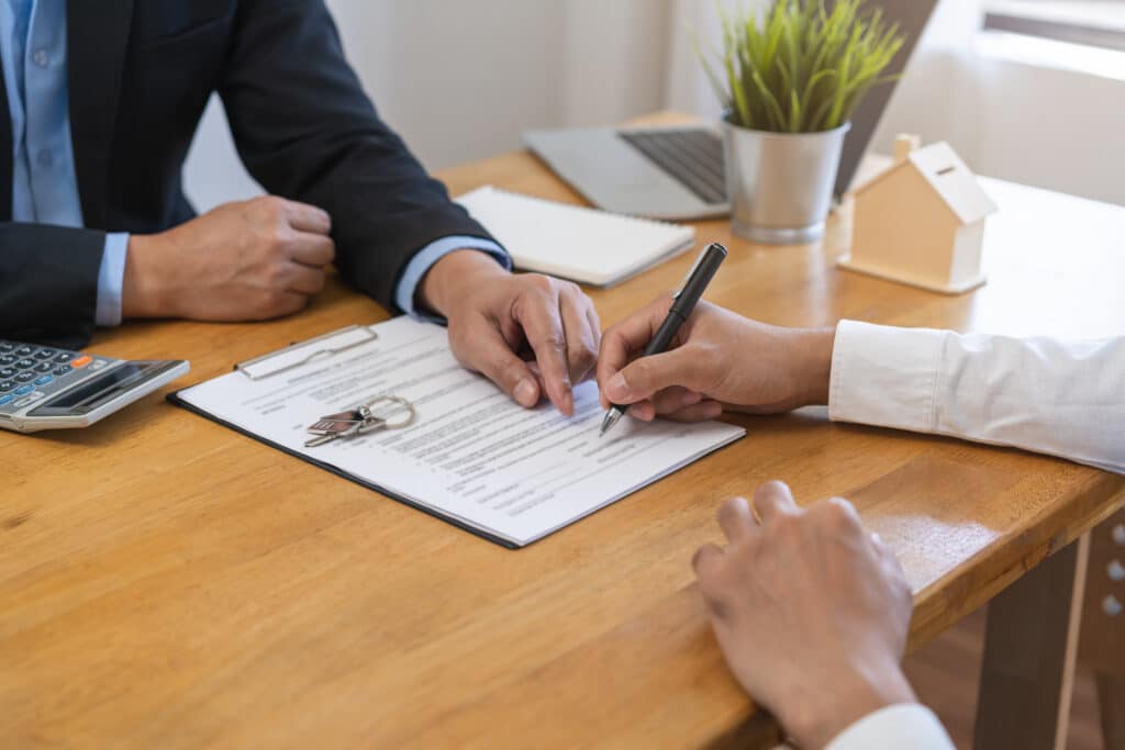 Buyer signing manufactured home purchase documents in Allendale, MI