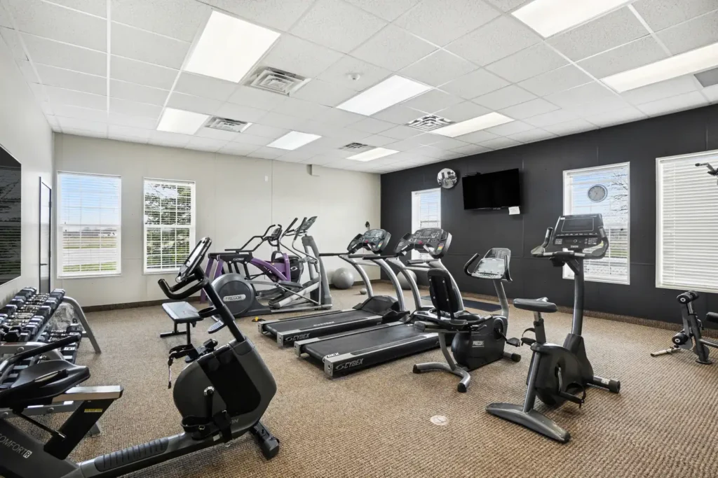 Resident fitness center with cardio machines at the manufactured home community in Allendale, MI