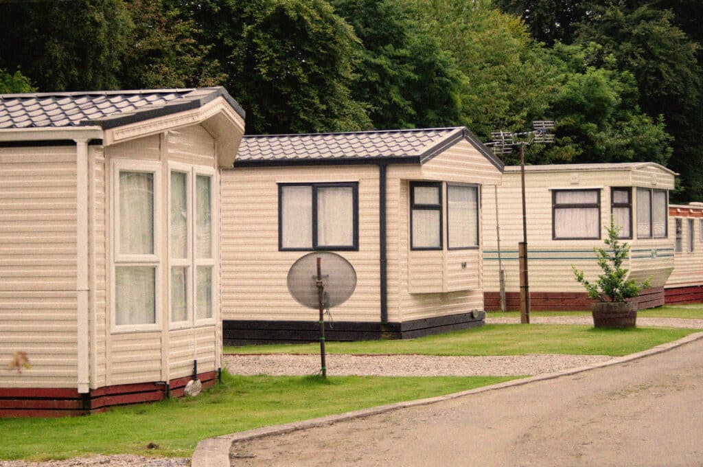 Row of older mobile homes in a park, from the history of manufactured housing in Allendale, MI