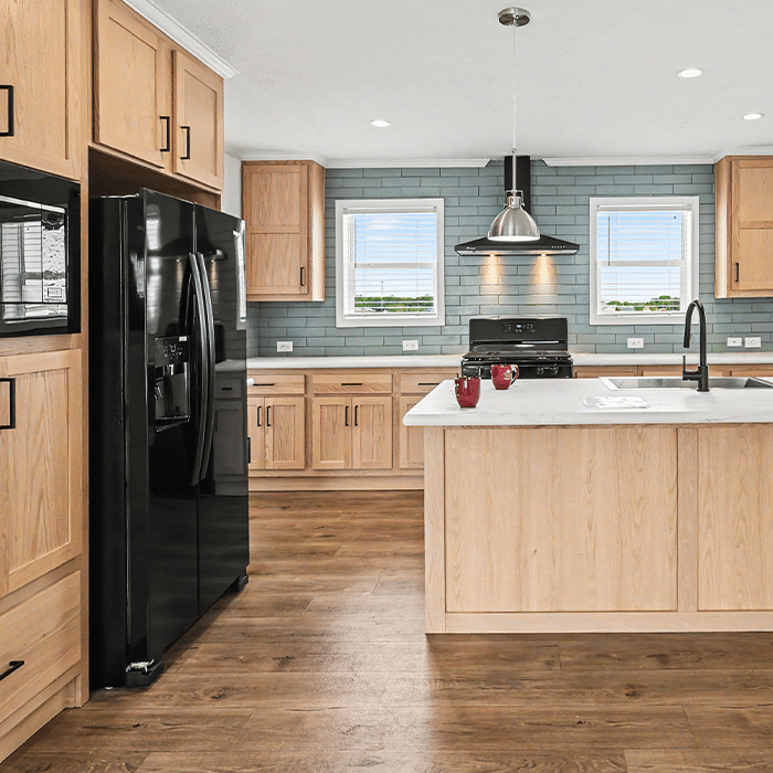 Oak kitchen with black appliances in a quality manufactured home near Holland, MI