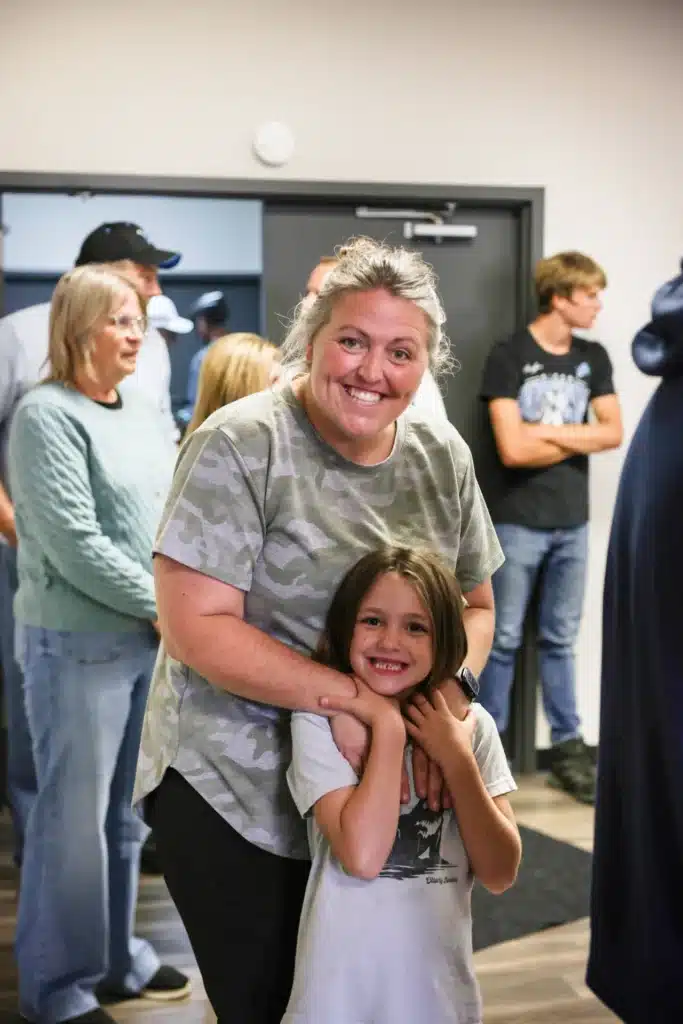 Mother and daughter smiling together at the Festive Celebration in Allendale, MI